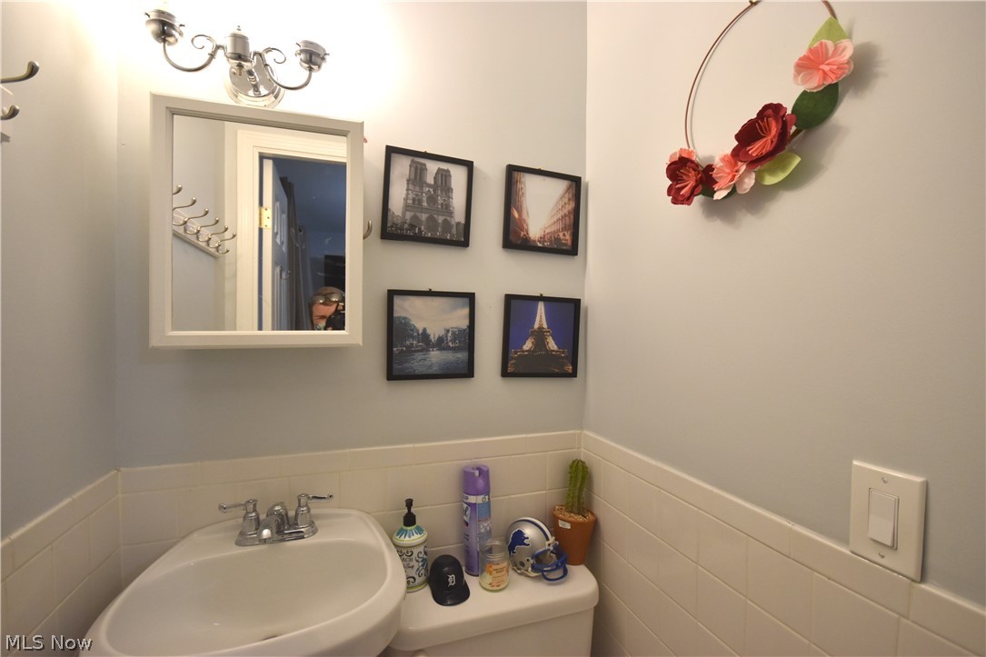 26719 Knickerbocker Road Bay Village, OH 44140 - Photo 10 of 25 Nice features of lighting, hooks and tile in the half bathroom!