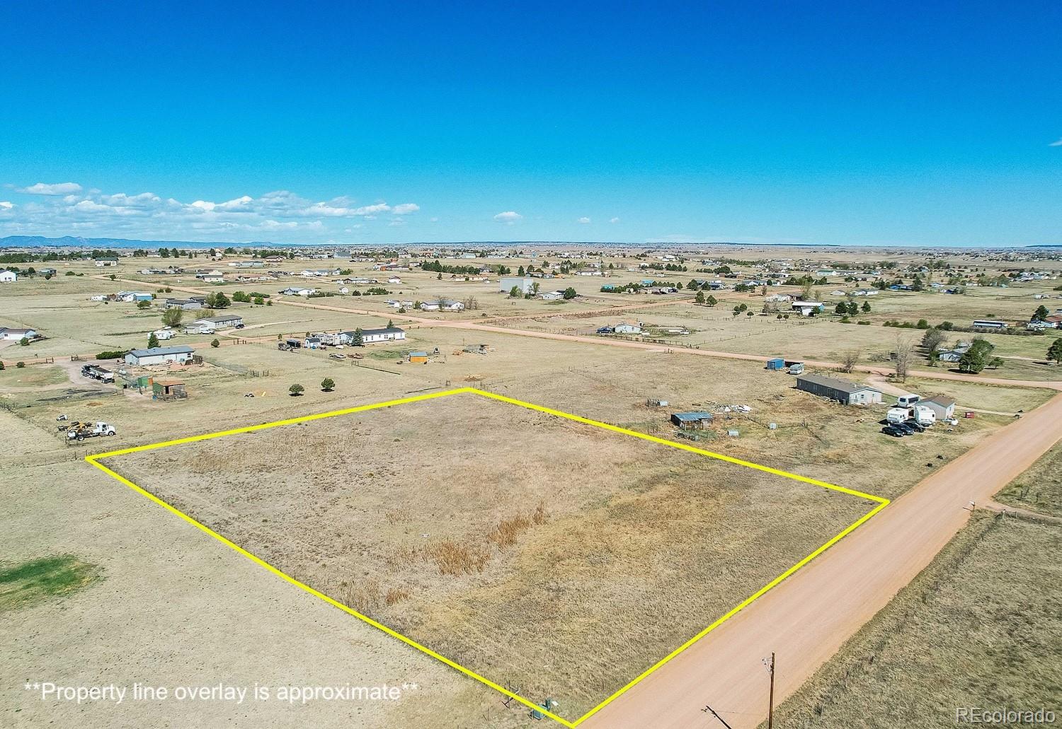 3640 Murr Road Peyton, CO 80831 - Photo 9 of 11 a view of beach and ocean