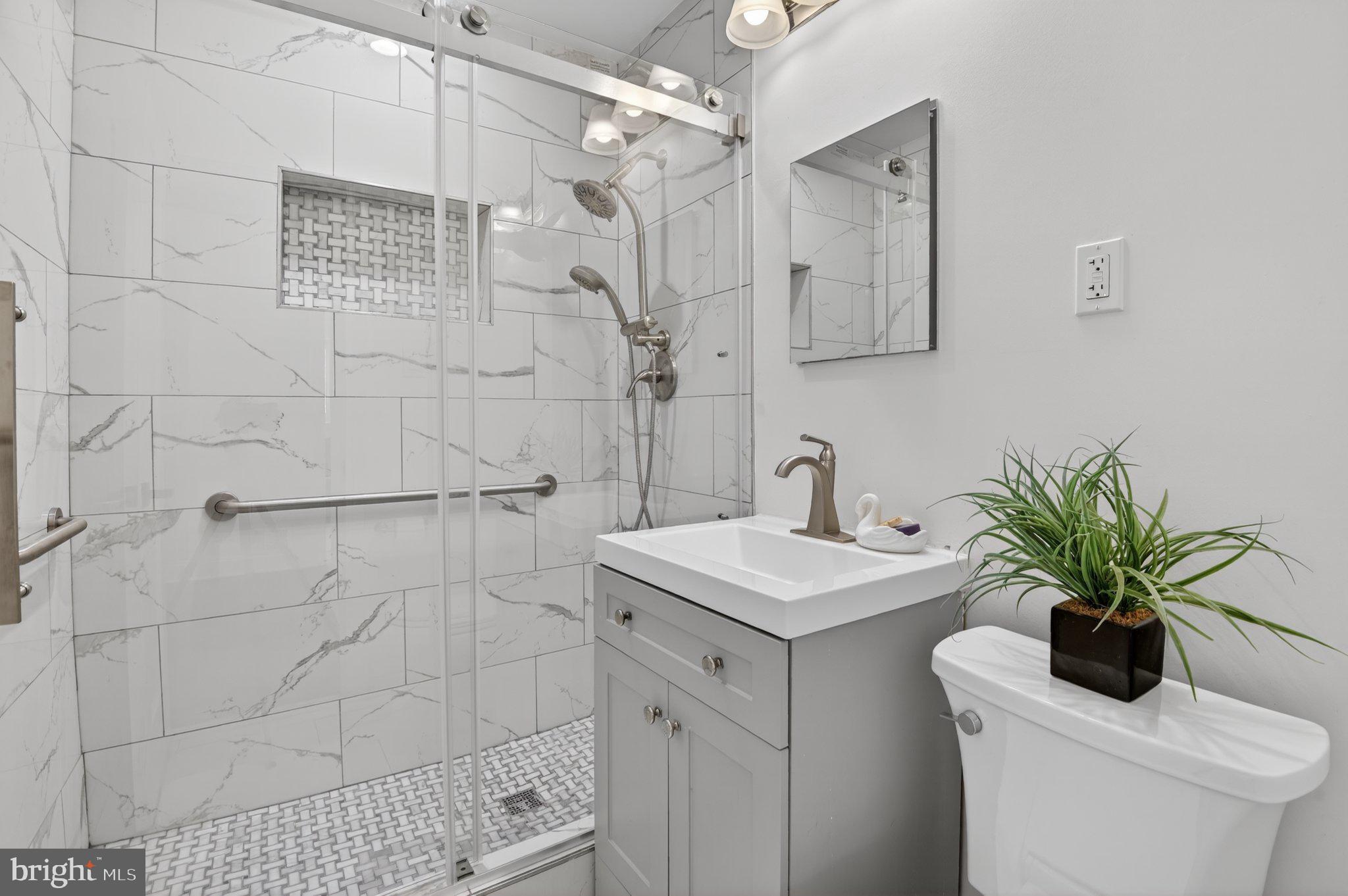 2215 Reedie Drive Wheaton, MD 20902 - Photo 11 of 22 Sleek modern bathroom oasis.