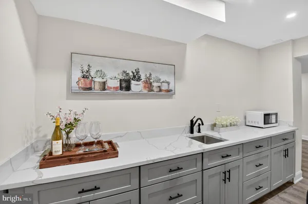 a kitchen with stainless steel appliances a refrigerator and a sink