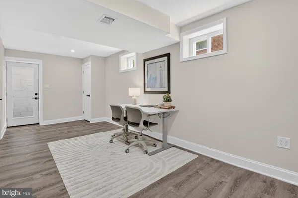 a bedroom with a bed and a night stand