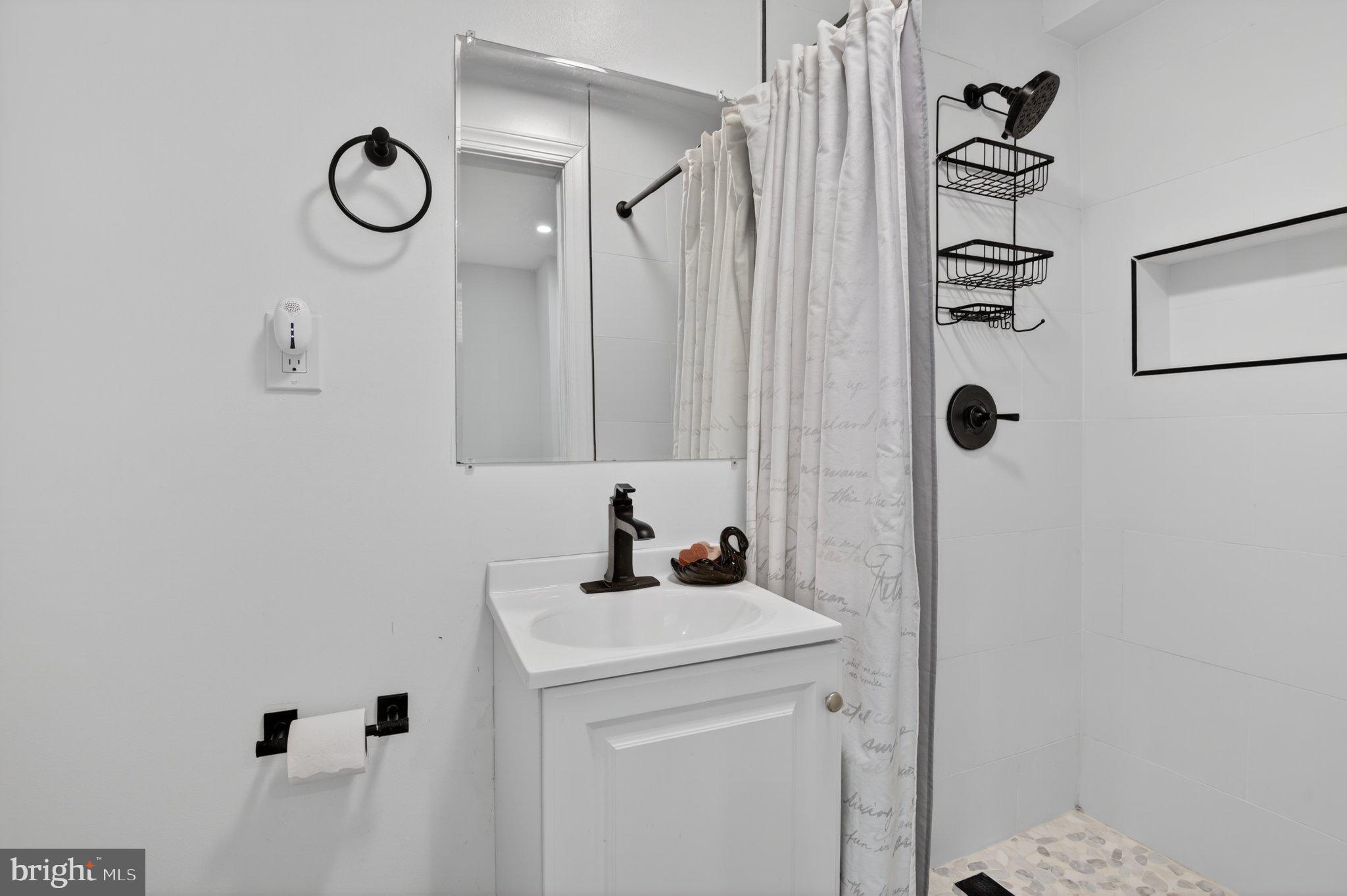 2215 Reedie Drive Wheaton, MD 20902 - Photo 19 of 22 Sleek modern bathroom oasis.