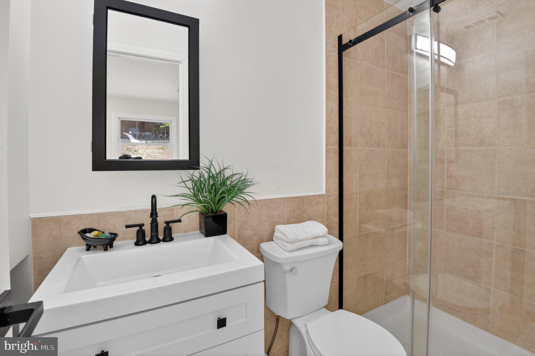 2215 Reedie Drive Wheaton, MD 20902 - Photo 8 of 22 Sleek modern bathroom oasis.
