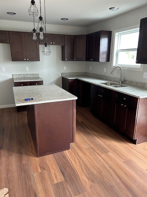 79.1 Periwinkle Court Morris, IL 60450 - Photo 3 of 12 a kitchen with stainless steel appliances granite countertop a sink a stove a refrigerator and cabinets
