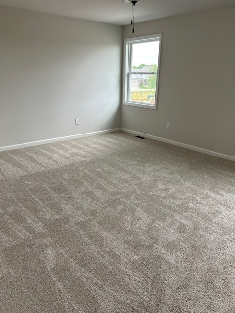 79.1 Periwinkle Court Morris, IL 60450 - Photo 10 of 12 an empty room with a window