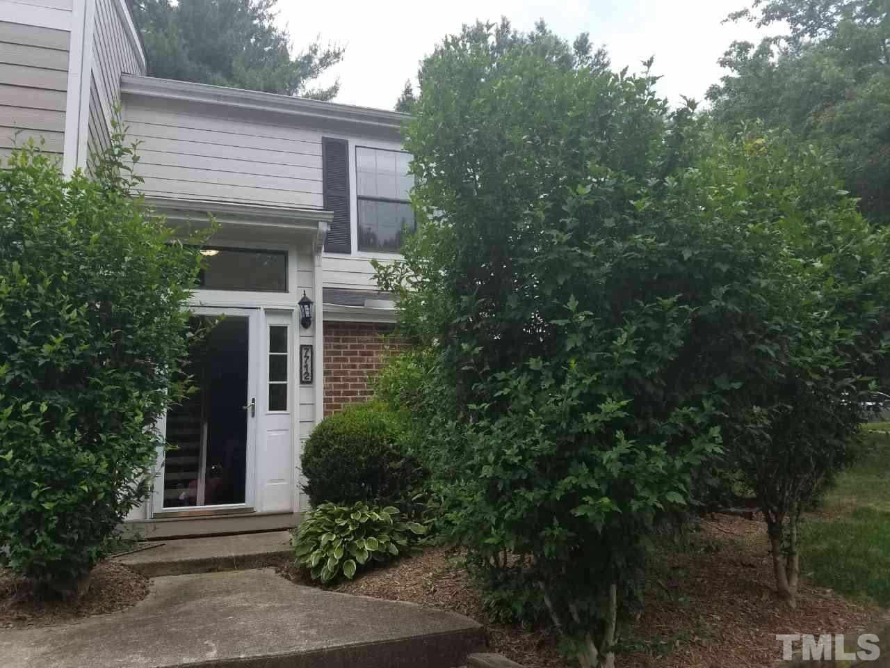 7712 Falcon Rest Circle, Unit 7712 Raleigh, NC 27615 - Photo 1 of 17 a view of a house with a tree