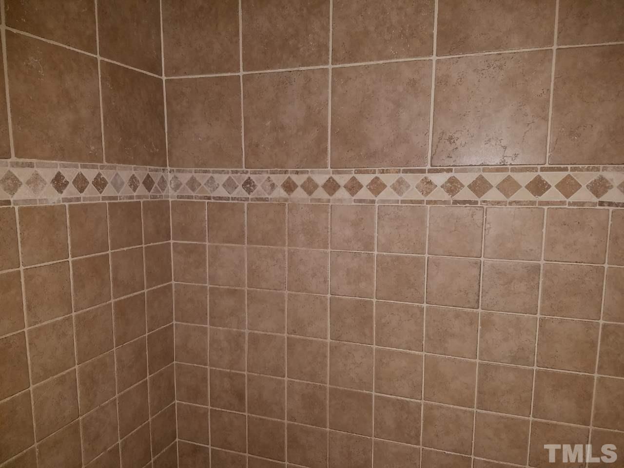 7712 Falcon Rest Circle, Unit 7712 Raleigh, NC 27615 - Photo 15 of 17 a bathroom with a shower