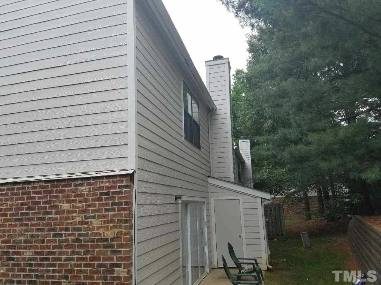 7712 Falcon Rest Circle, Unit 7712 Raleigh, NC 27615 - Photo 4 of 17 a view of a house with a yard