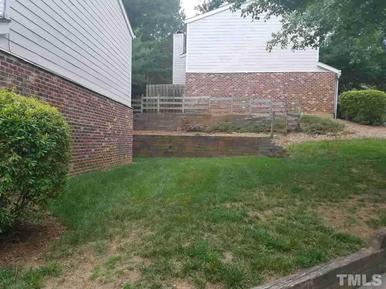 7712 Falcon Rest Circle, Unit 7712 Raleigh, NC 27615 - Photo 5 of 17 a view of house with backyard