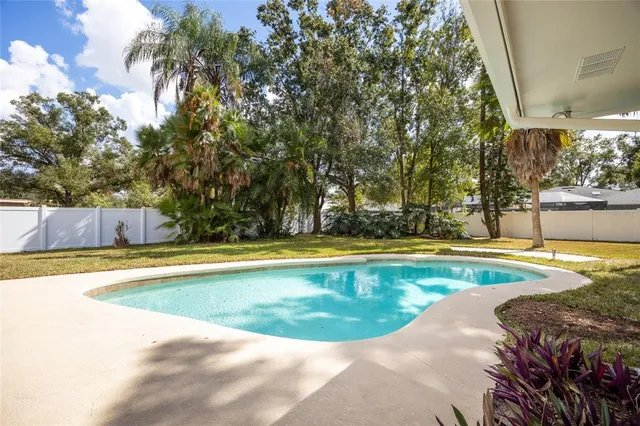 a view of swimming pool with seating space