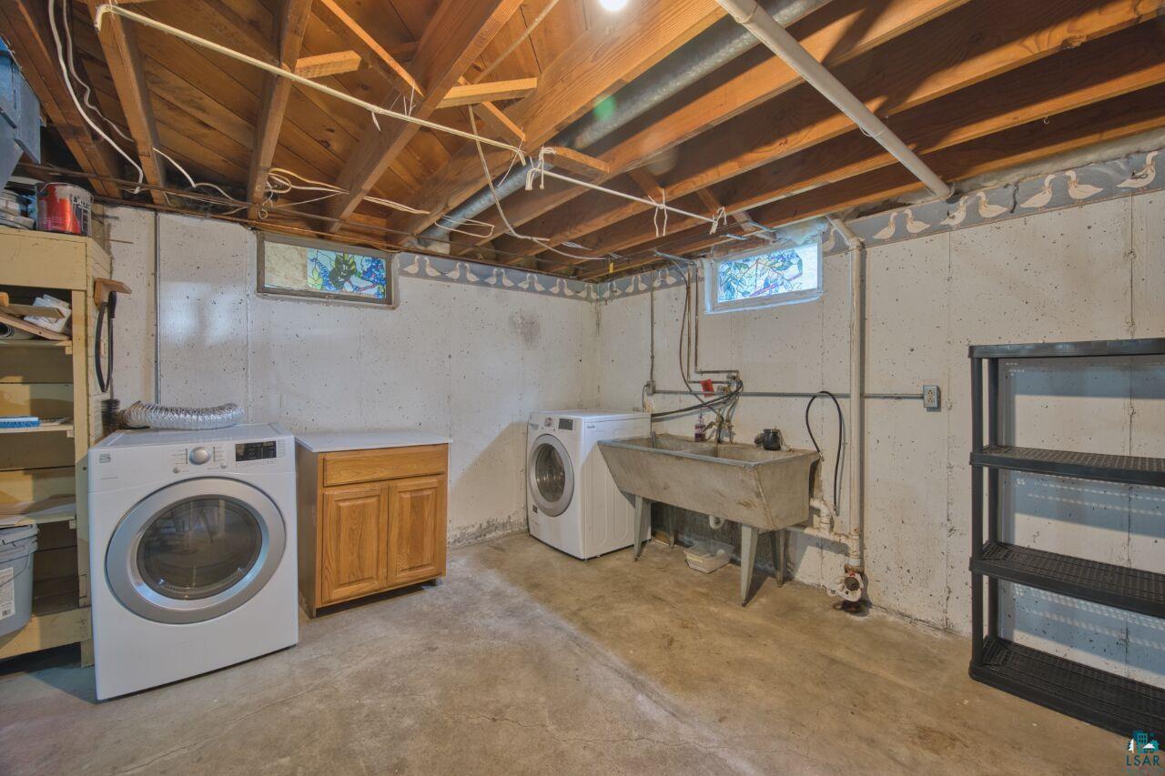 5316 Highway 110 Aurora, MN 55705 - Photo 18 of 35 Washroom with cabinet space and washing machine and dryer
