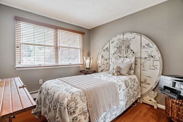 25 Osborne Street Lynn, MA 01905 - Photo 11 of 40 a bedroom with a large bed and a window