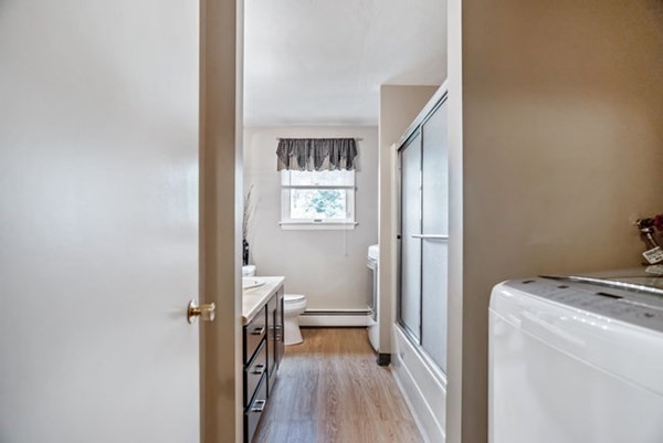 25 Osborne Street Lynn, MA 01905 - Photo 12 of 40 a view of room with window and wooden floor