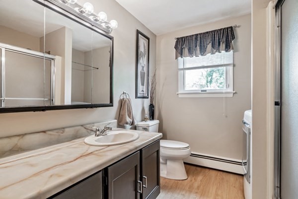 25 Osborne Street Lynn, MA 01905 - Photo 13 of 40 a bathroom with a granite countertop sink toilet and mirror