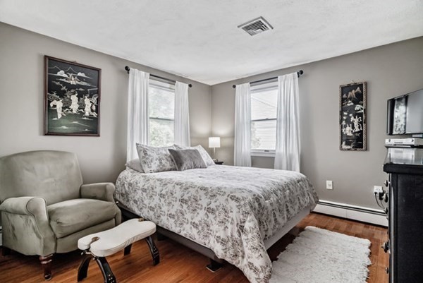 25 Osborne Street Lynn, MA 01905 - Photo 14 of 40 a bedroom with a bed a couch and a window