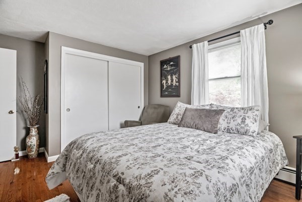 25 Osborne Street Lynn, MA 01905 - Photo 15 of 40 a bedroom with a large bed and a window