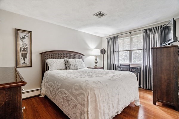 25 Osborne Street Lynn, MA 01905 - Photo 16 of 40 a bedroom with a bed and wooden floor