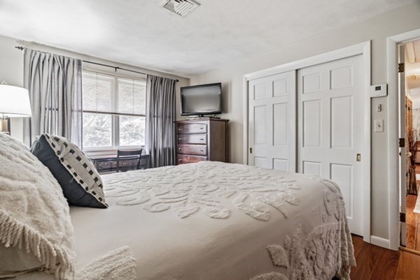25 Osborne Street Lynn, MA 01905 - Photo 17 of 40 a bedroom with a bed flat screen tv and a window
