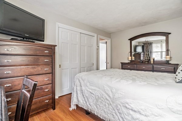 25 Osborne Street Lynn, MA 01905 - Photo 19 of 40 a bedroom with a bed and a flat screen tv