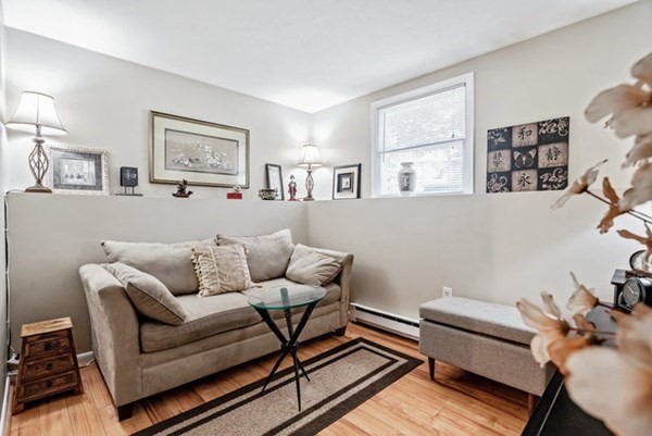 25 Osborne Street Lynn, MA 01905 - Photo 26 of 40 a living room with furniture and a window