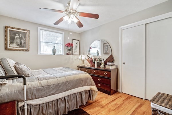 25 Osborne Street Lynn, MA 01905 - Photo 28 of 40 a bedroom with a bed a dresser and chair