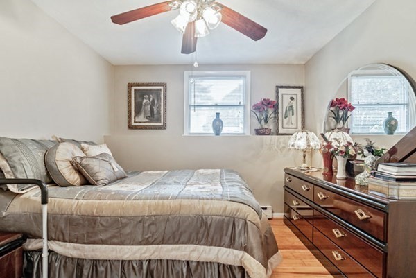 25 Osborne Street Lynn, MA 01905 - Photo 29 of 40 a bedroom with a bed and a dresser