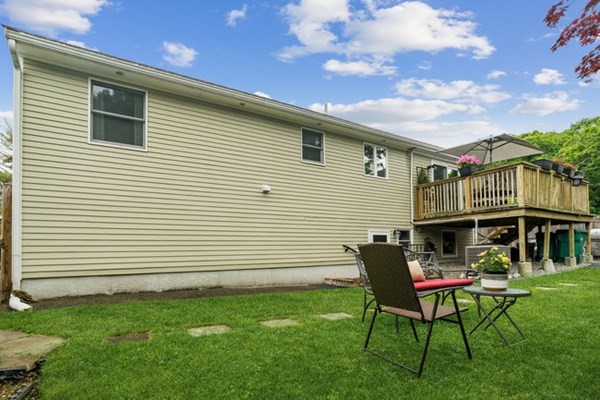 25 Osborne Street Lynn, MA 01905 - Photo 33 of 40 a backyard of a house with table and chairs