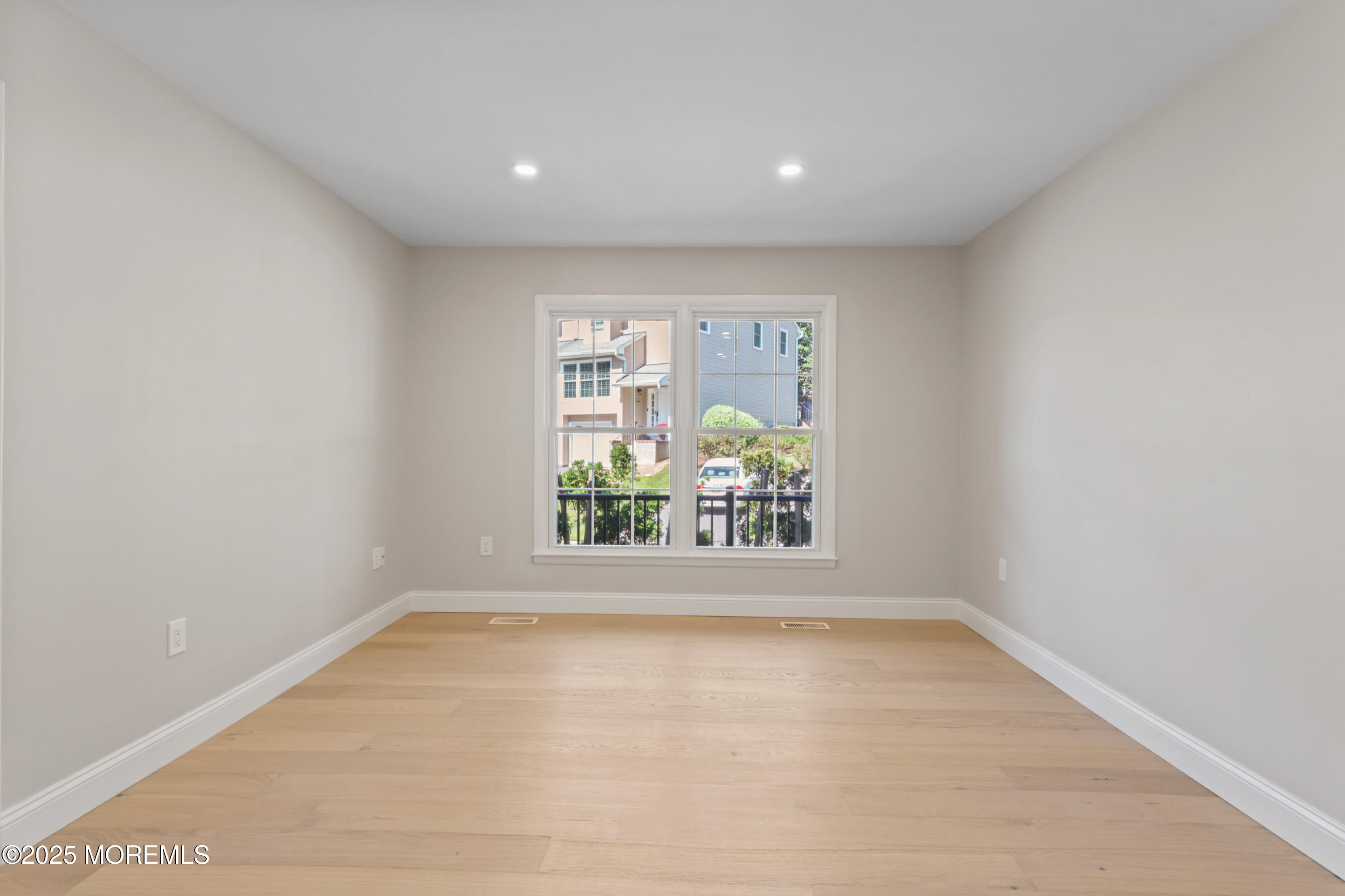 23 Mulberry Court, Unit D Brielle, NJ 08730 - Photo 13 of 40 an empty room with windows and outdoor view