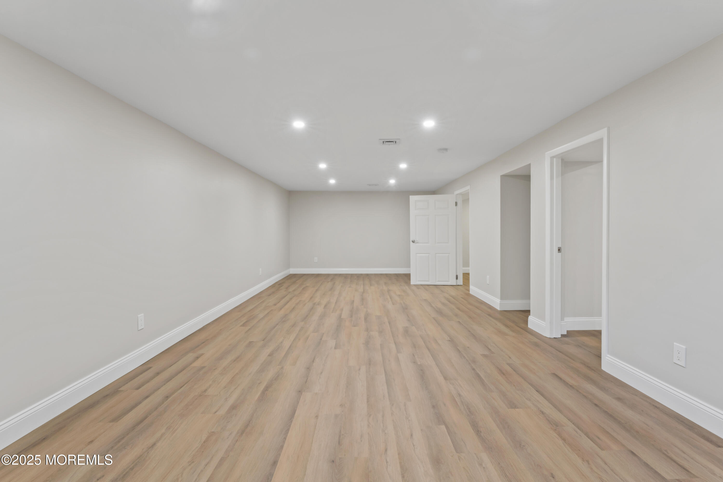 23 Mulberry Court, Unit D Brielle, NJ 08730 - Photo 26 of 40 a view of empty room with wooden floor
