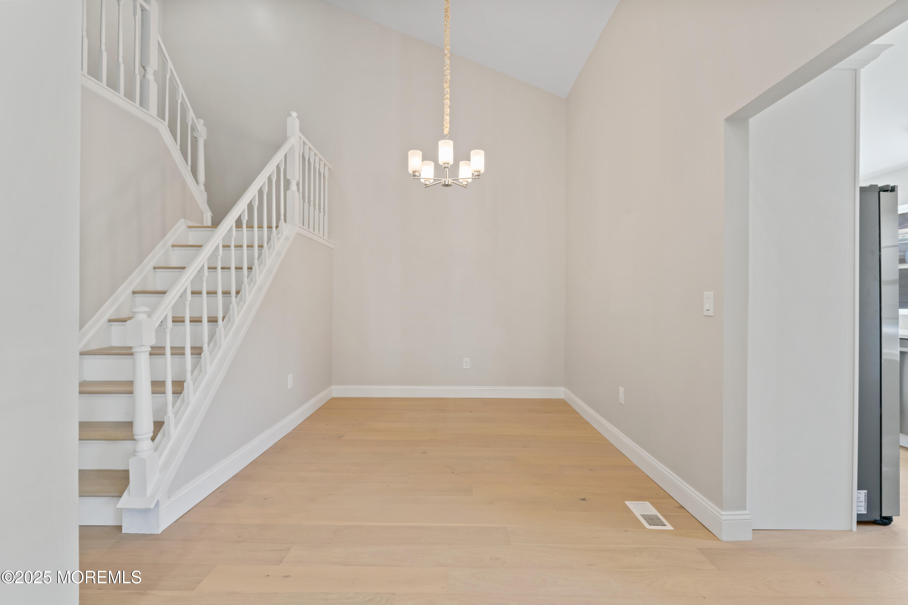 23 Mulberry Court, Unit D Brielle, NJ 08730 - Photo 8 of 40 a view of an empty room with stairs