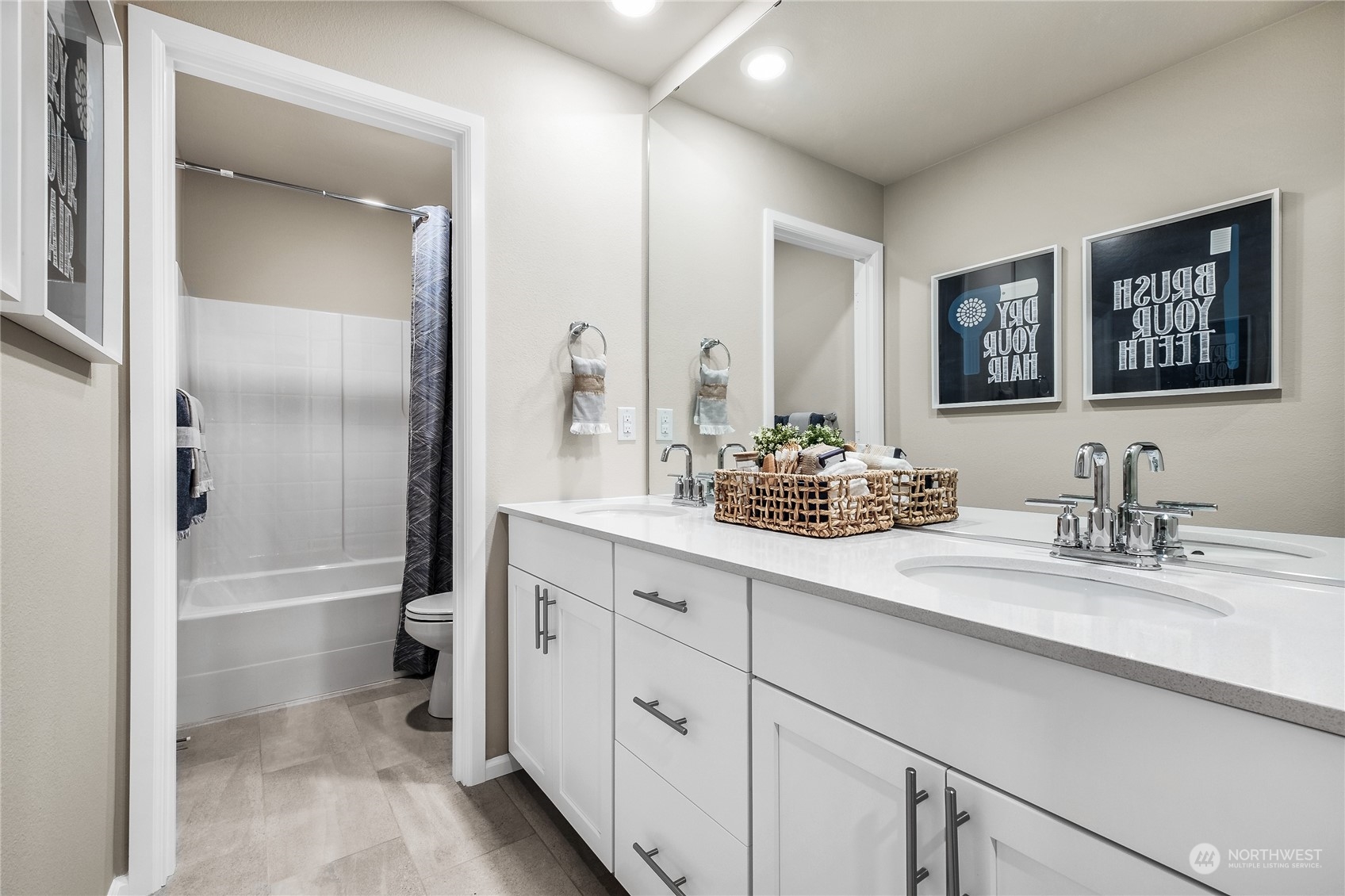 21113 42nd Avenue Southeast, Unit 120 Bothell, WA 98021 - Photo 13 of 16 a bathroom with double sink and a mirror