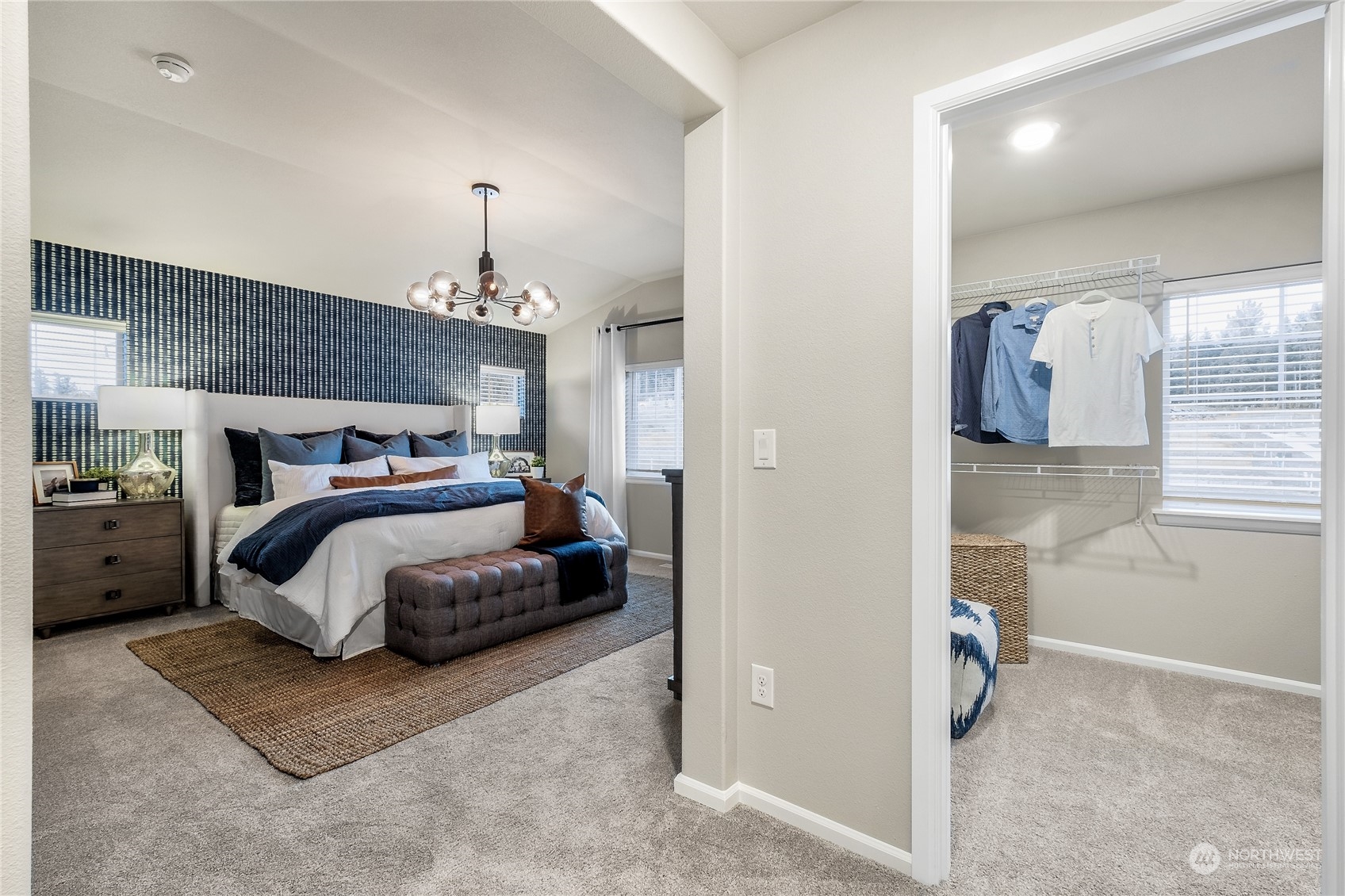 21113 42nd Avenue Southeast, Unit 120 Bothell, WA 98021 - Photo 15 of 16 a bedroom with bed and a walk in closet