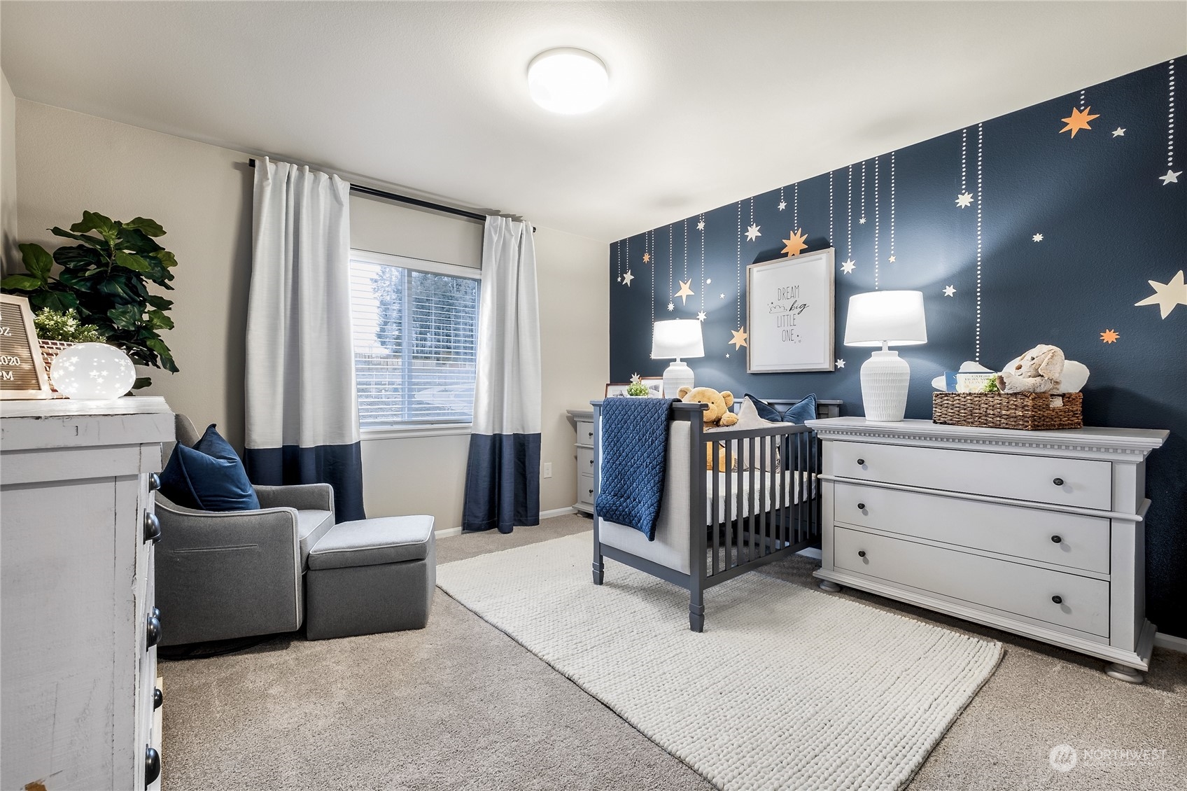 21113 42nd Avenue Southeast, Unit 120 Bothell, WA 98021 - Photo 2 of 16 a bedroom with furniture and a large window