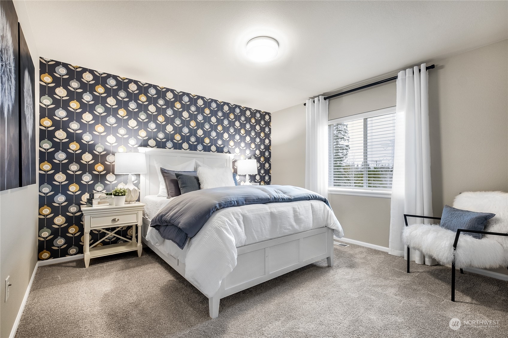 21113 42nd Avenue Southeast, Unit 120 Bothell, WA 98021 - Photo 3 of 16 a bedroom with a bed and a chair