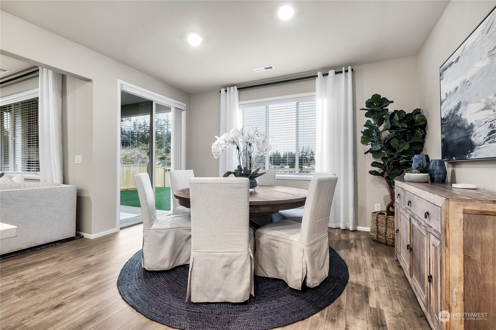 21113 42nd Avenue Southeast, Unit 120 Bothell, WA 98021 - Photo 6 of 16 a living room with furniture and a large window