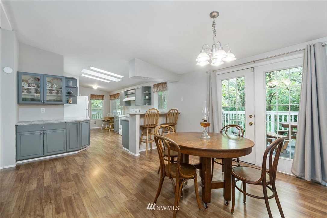 106 Slide Creek Road Longview, WA 98632 - Photo 19 of 38 a view of a dining room with furniture window and outside view