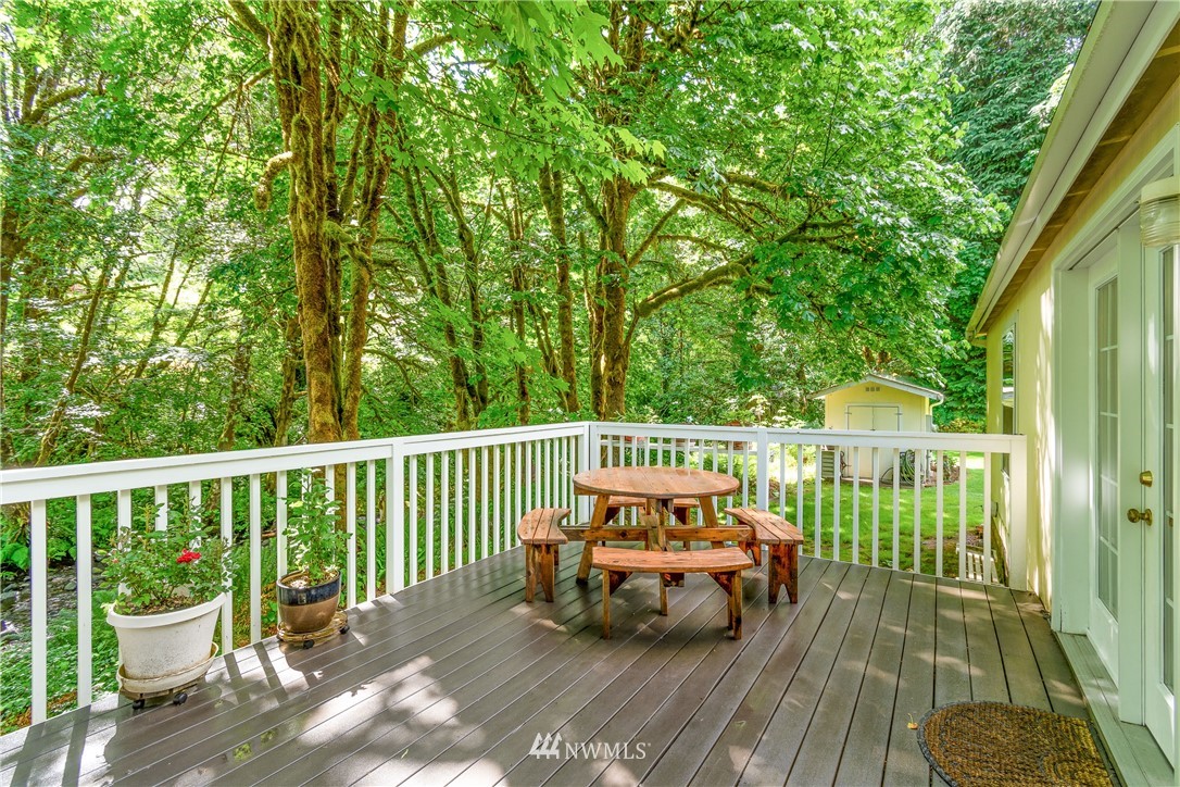 106 Slide Creek Road Longview, WA 98632 - Photo 20 of 38 a view of a wooden deck with a bench