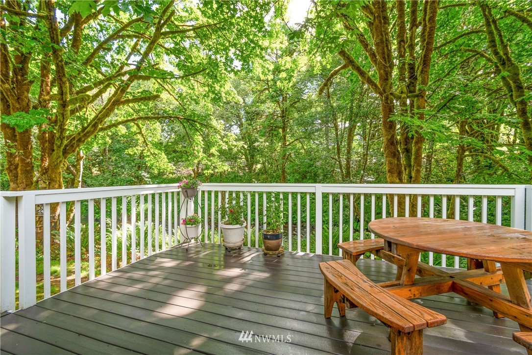 106 Slide Creek Road Longview, WA 98632 - Photo 21 of 38 a view of a wooden deck with furniture