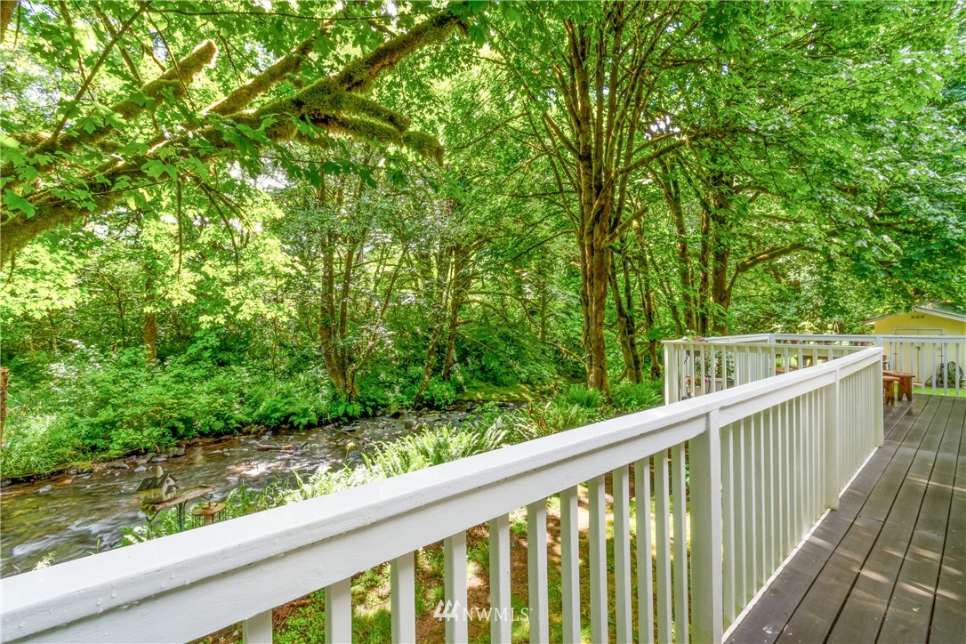 106 Slide Creek Road Longview, WA 98632 - Photo 23 of 38 a view of a balcony with wooden floor and fence