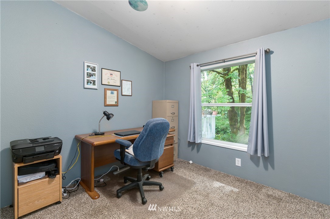106 Slide Creek Road Longview, WA 98632 - Photo 33 of 38 a view of a workspace with furniture and a window