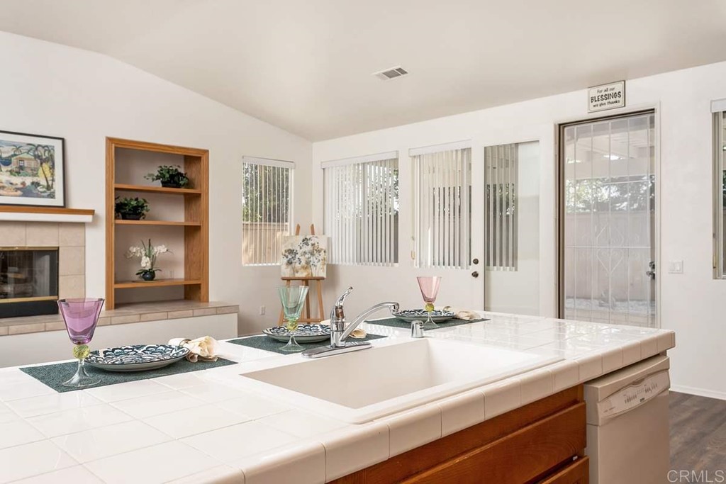 567 Big Sky Drive Oceanside, CA 92058 - Photo 11 of 27 a view of a kitchen with granite countertop a sink and a counter top space