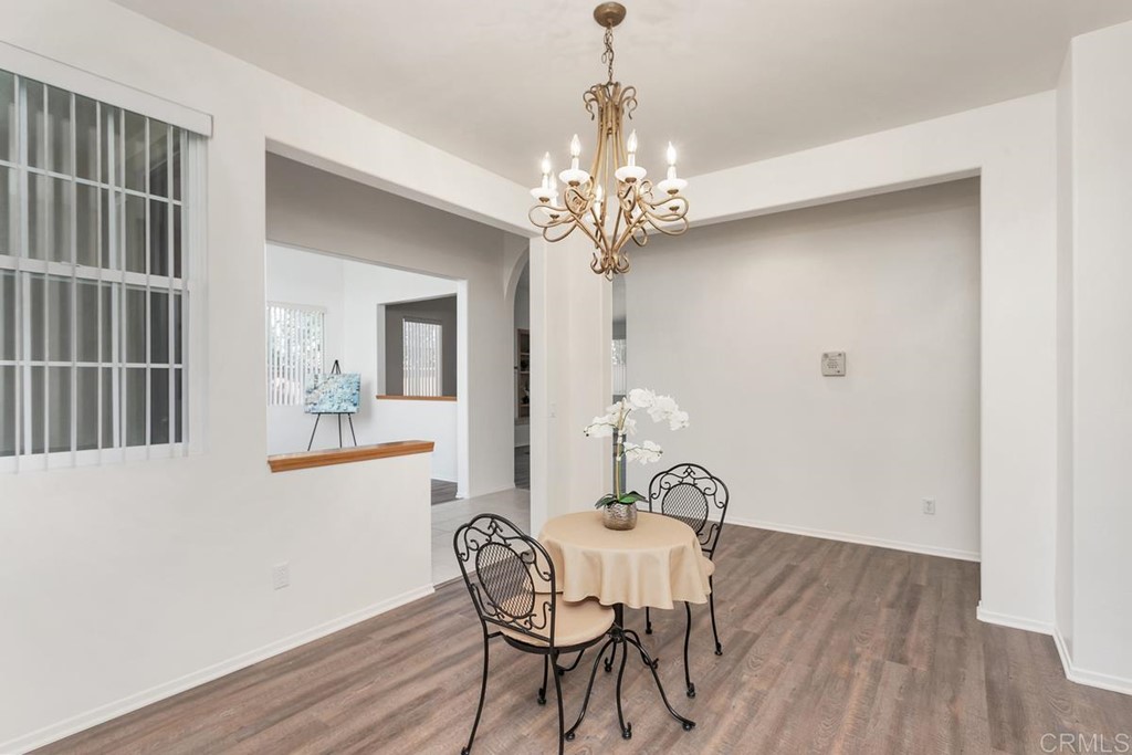 567 Big Sky Drive Oceanside, CA 92058 - Photo 27 of 27 a view of a dining room with furniture and wooden floor