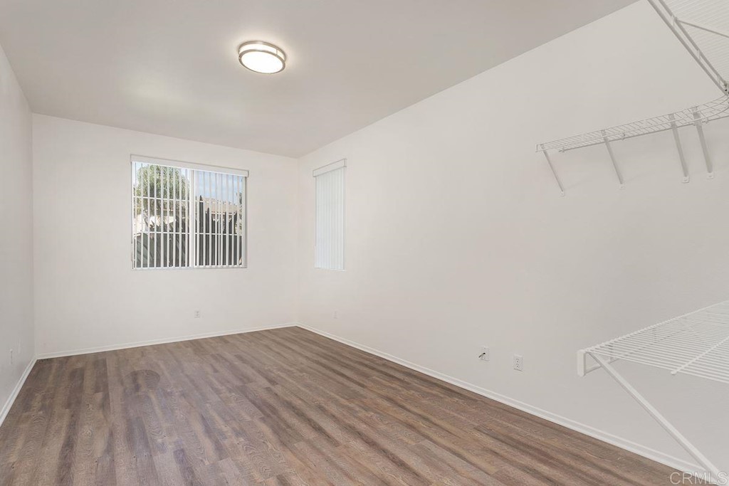 567 Big Sky Drive Oceanside, CA 92058 - Photo 22 of 27 a view of empty room with wooden floor and fan
