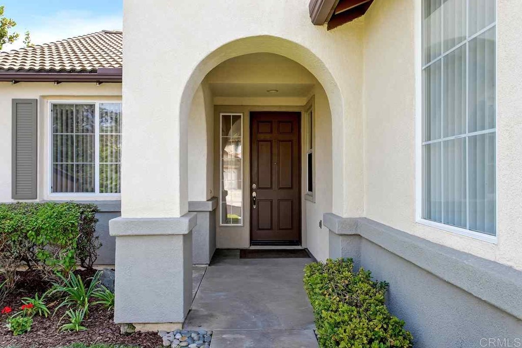 567 Big Sky Drive Oceanside, CA 92058 - Photo 3 of 27 a front view of a house with a garage