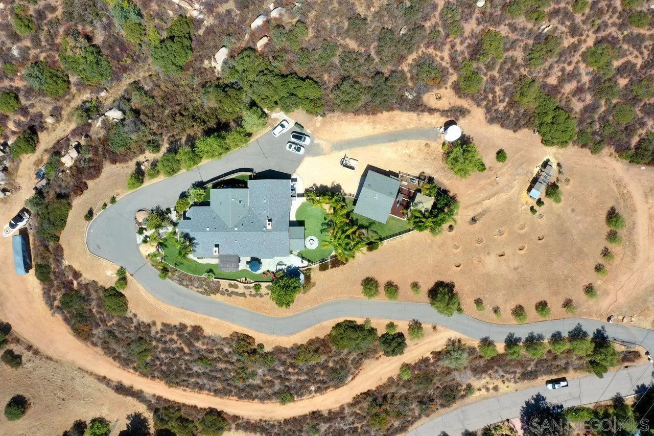 2868 Harper Ranch Road Jamul, CA 91935 - Photo 50 of 59 a view of a swimming pool with a yard