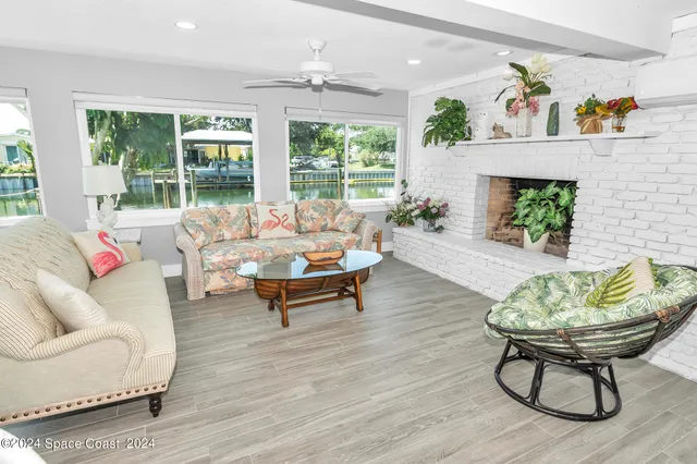 a kitchen with a sink dishwasher a stove a dining table and chairs