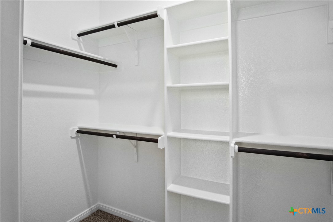 3211 Llano Alto Circle Temple, TX 76504 - Photo 16 of 29 a view of walk in closet with empty racks