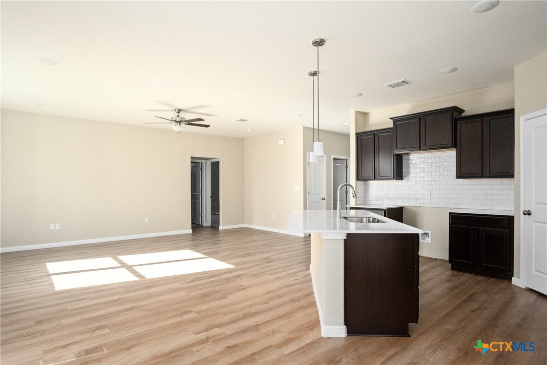 3211 Llano Alto Circle Temple, TX 76504 - Photo 10 of 29 a kitchen with kitchen island a counter top space a sink and appliances