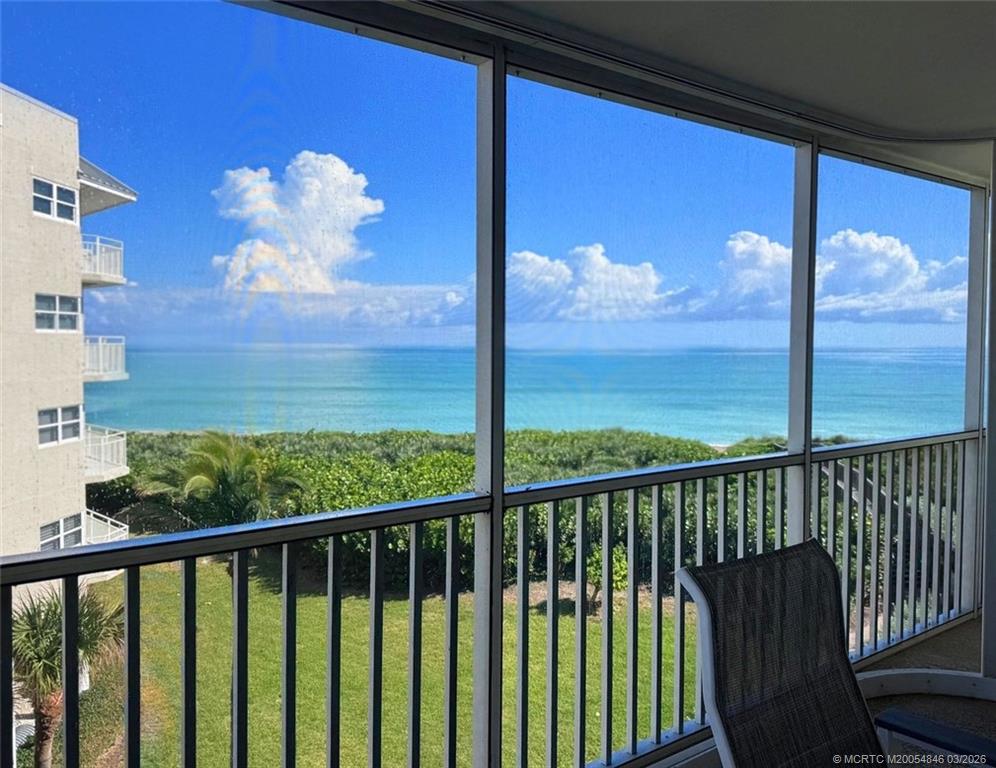 529 Northeast Plantation Road, Unit 310 Jensen Beach, FL 34957 - Photo 3 of 12 a view of a balcony with a swing chair