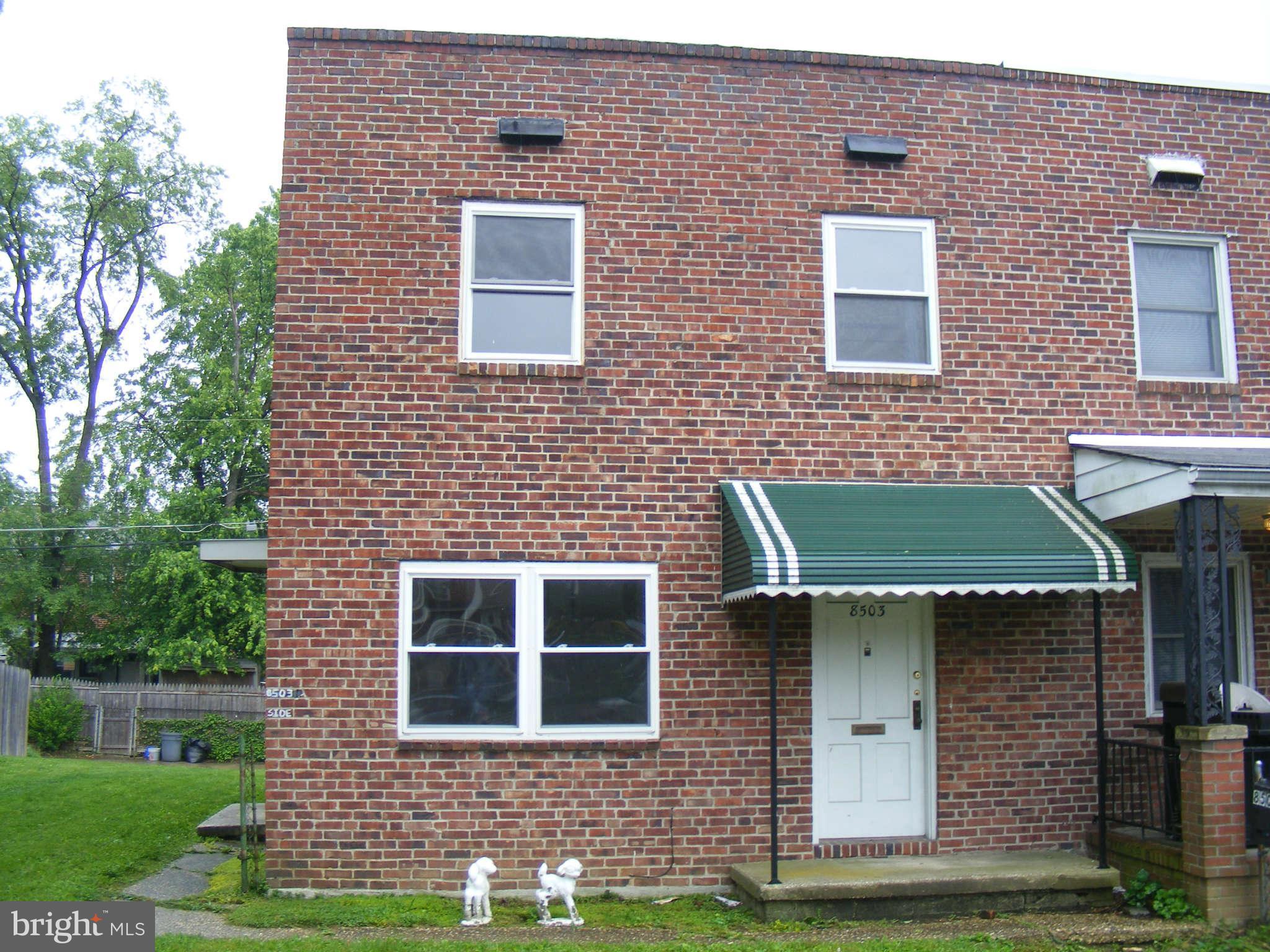 8503 Chestnut Oak Road Baltimore, MD 21234 - Photo 1 of 13 a front view of a house with a yard